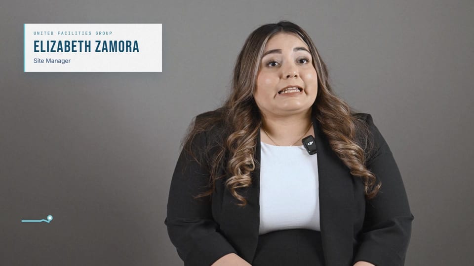Elizabeth Zamora speaking in a black blazer over a white top, a frame from the film We Save Lives