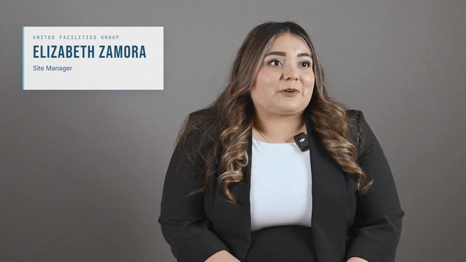 Elizabeth Zamora in a black blazer over a white top, looking at camera, a frame from the longer film No Dust