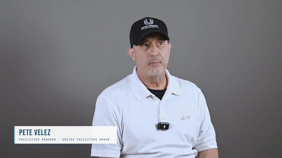 Pete Velez in a black UFG cap and white polo, looking aside, a frame from the film Start With the Need